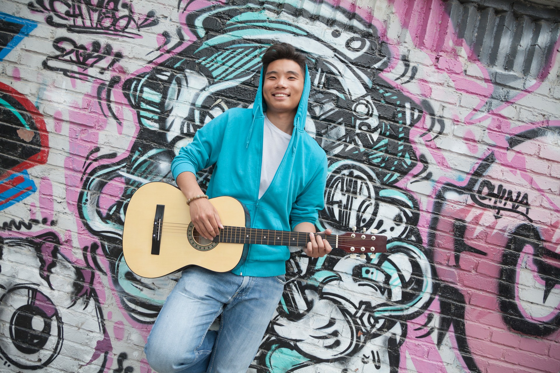 Young smiling street musician