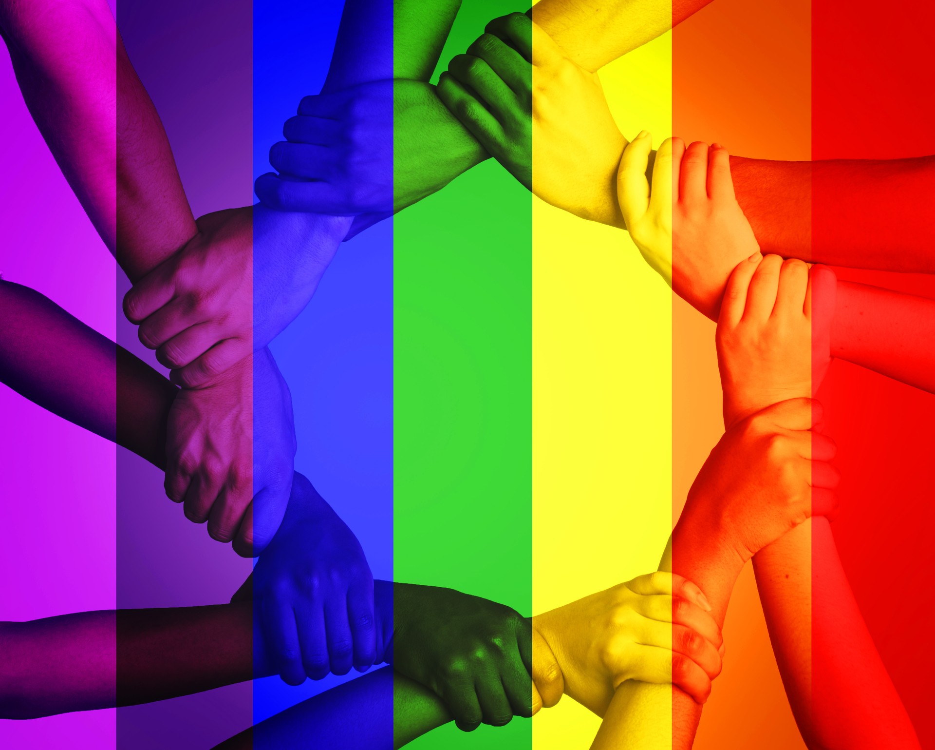 Cropped shot of unrecognizable people linking arms against a multi colored overlay